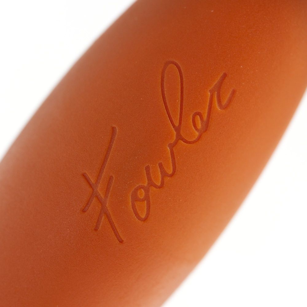 Close-up of an orange Sparrow handle with Zach Fowler's signature across it